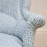 SMALL ARMCHAIR REUPHOLSTERED IN PRINTED LINEN FABRIC