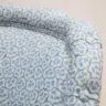 SMALL ARMCHAIR REUPHOLSTERED IN PRINTED LINEN FABRIC