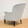 SMALL ARMCHAIR REUPHOLSTERED IN PRINTED LINEN FABRIC