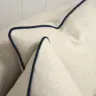 Curved Sofa Reupholstered in a Cream Fabric with Dark Contrast Piping