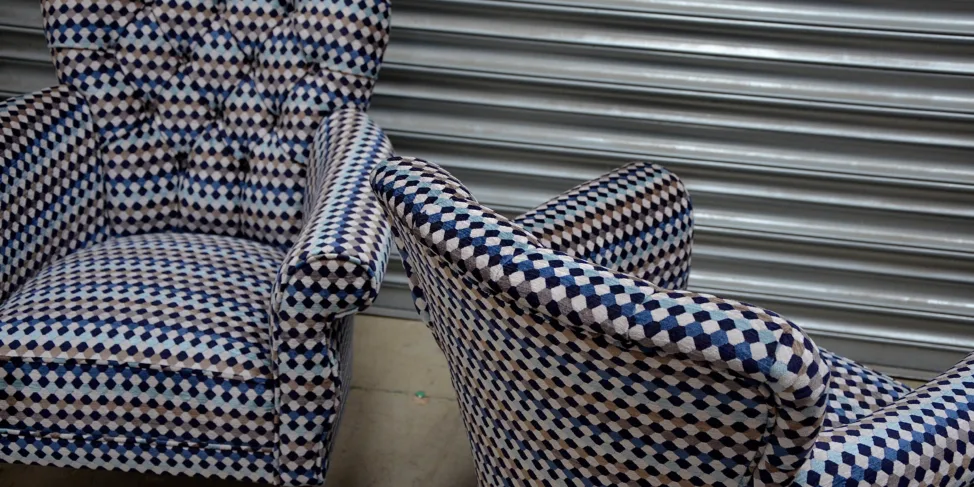 A Pair of Buttoned Back Chairs Reupholstered in Oreta Twilight, Romo Fabric