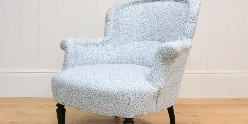 SMALL ARMCHAIR REUPHOLSTERED IN PRINTED LINEN FABRIC