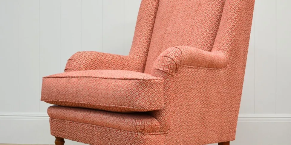 A high back Wesley Barrell chair, recovered in a small scale diamond chenille fabric