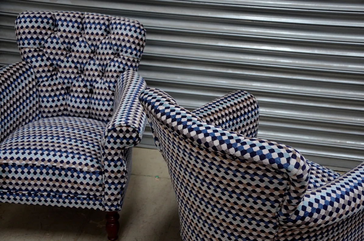 A Pair of Buttoned Back Chairs Reupholstered in Oreta Twilight, Romo Fabric