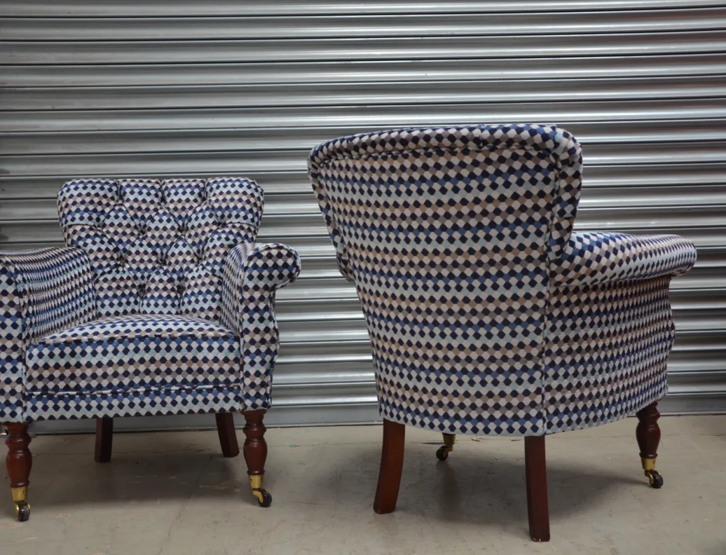 A Pair of Buttoned Back Chairs Reupholstered in Oreta Twilight, Romo Fabric