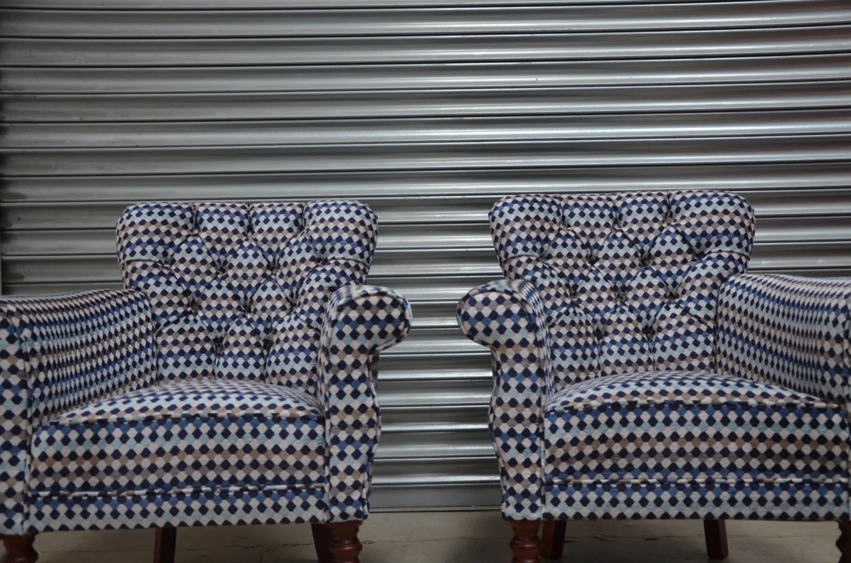 A Pair of Buttoned Back Chairs Reupholstered in Oreta Twilight, Romo Fabric