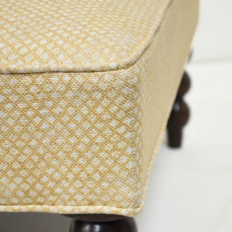 Ottoman with Carved Wooden Legs Recovered in a Printed Fabric