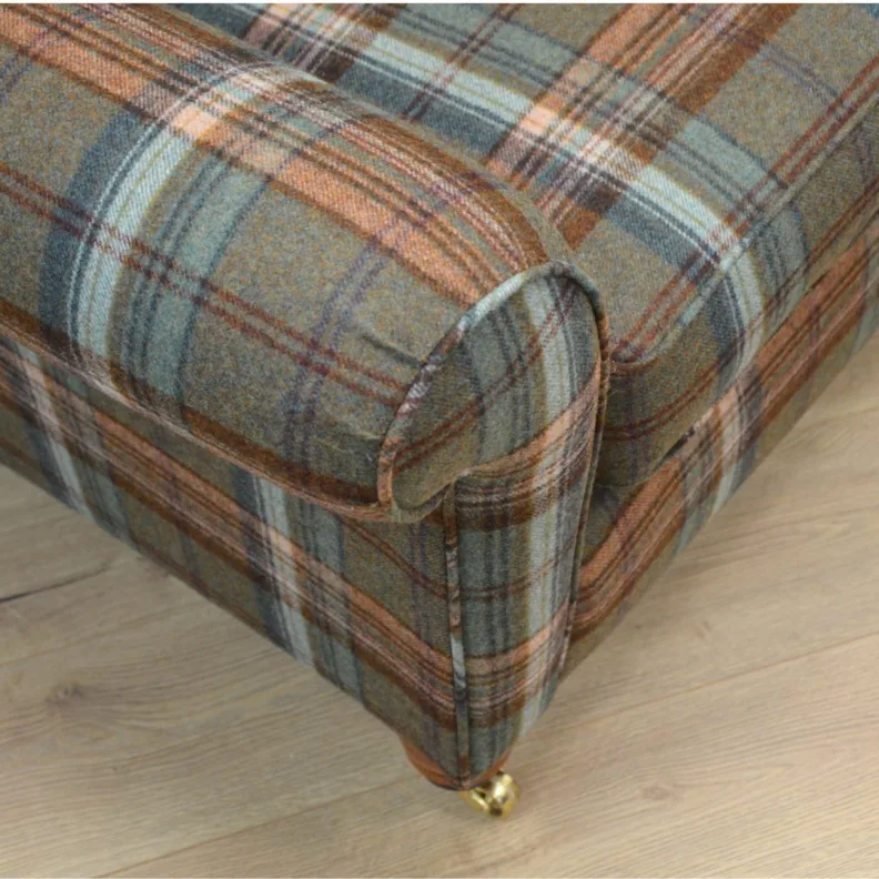 Sofa recovered in a tartan wool